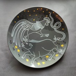 Decorative ceramic plate "Pig, Rooster, and Snake" from the series "The Chase"