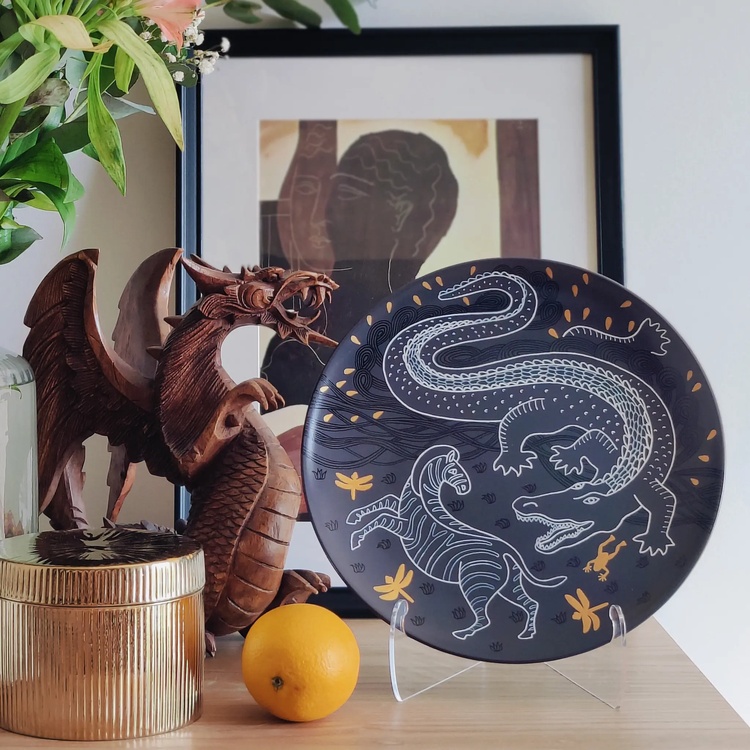 Decorative ceramic plate "Crocodile and Zebra" from the series "The Chase"