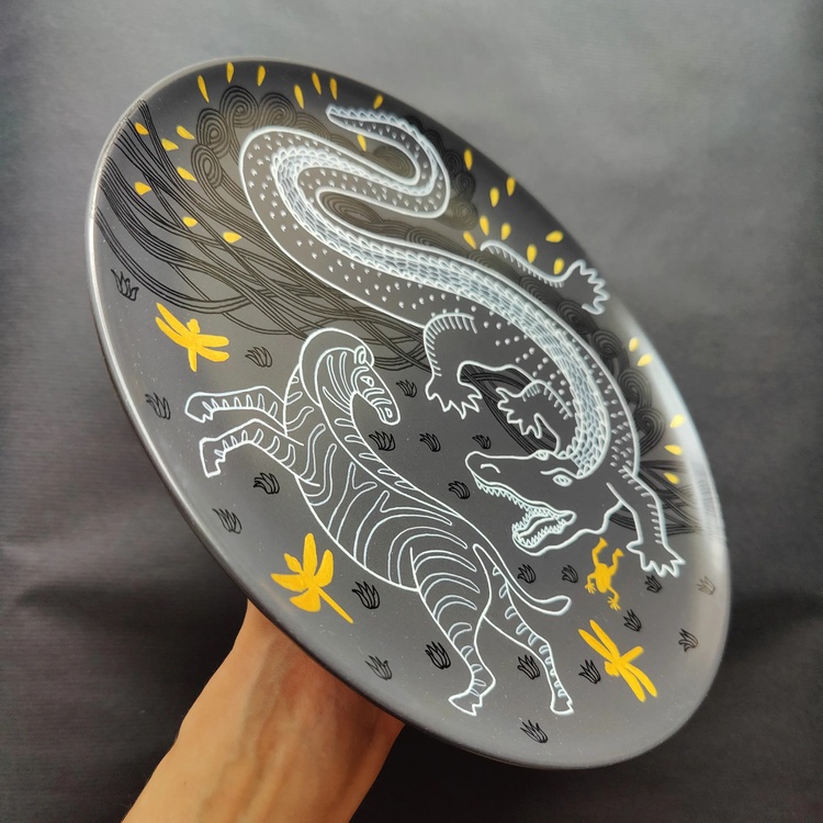 Decorative ceramic plate "Crocodile and Zebra" from the series "The Chase"