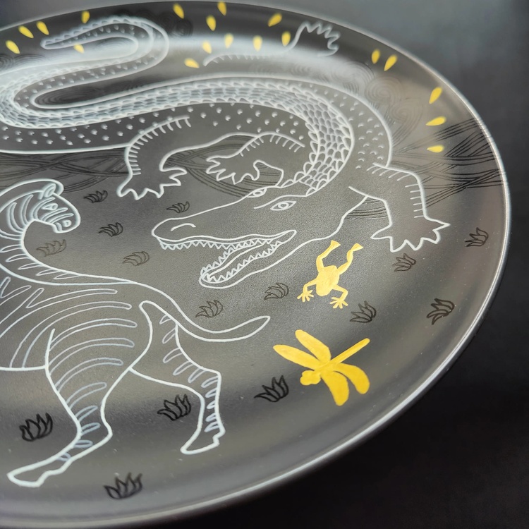 Decorative ceramic plate "Crocodile and Zebra" from the series "The Chase"